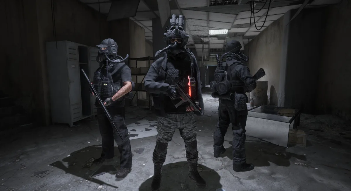 Official screenshot: three armed operators in gas masks stand inside a concrete interior.